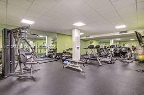 gym featuring a paneled ceiling