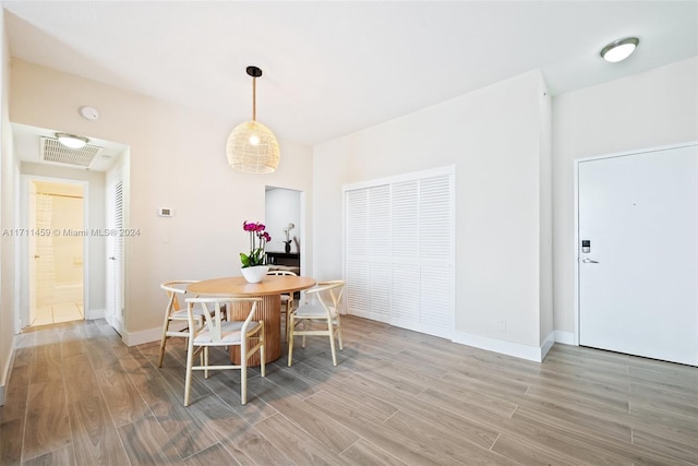 dining room with hardwood / wood-style floors