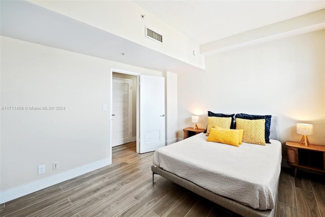 bedroom featuring wood-type flooring