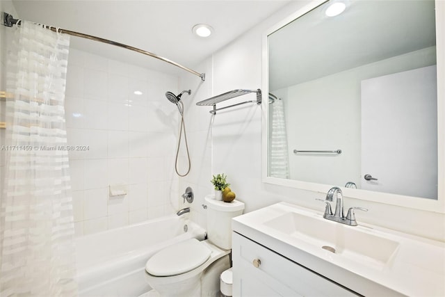 full bathroom with vanity, shower / tub combo, and toilet