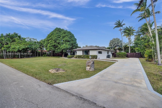 single story home with a front lawn