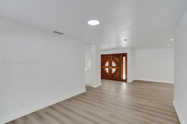 unfurnished room featuring light wood-type flooring