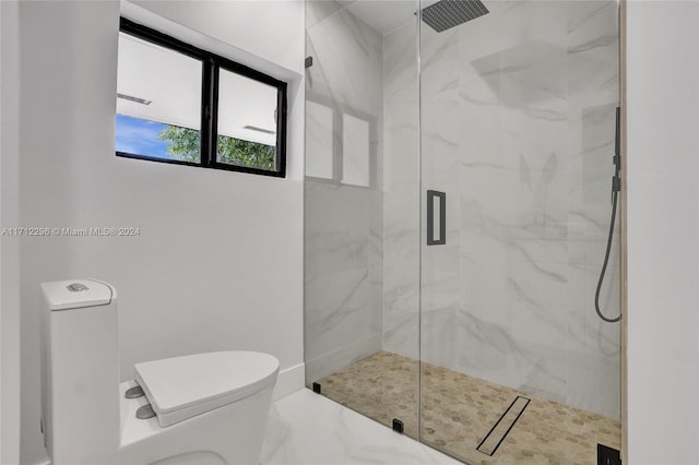 bathroom featuring toilet and walk in shower