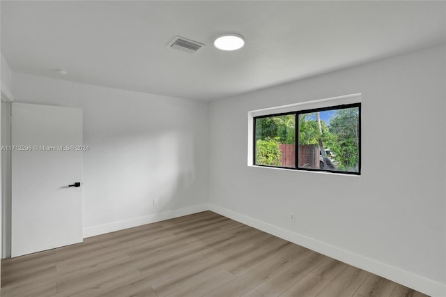 spare room with light wood-type flooring