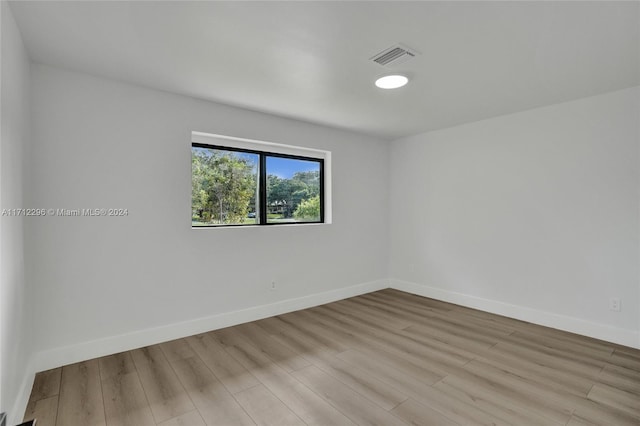 spare room with light wood-type flooring