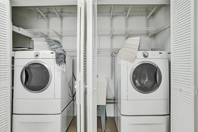 clothes washing area featuring hardwood / wood-style flooring