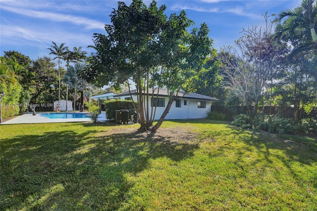 view of yard featuring a fenced in pool