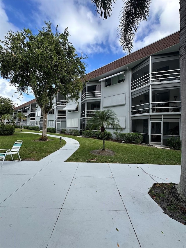 surrounding community featuring a lawn