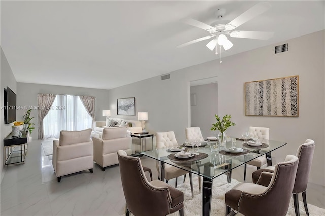 dining space featuring ceiling fan