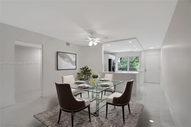 dining space with ceiling fan