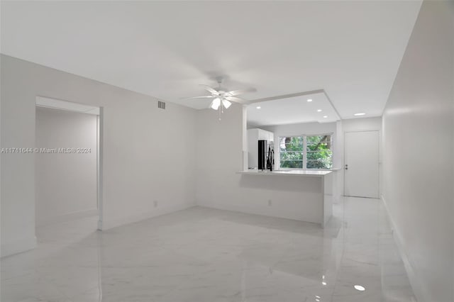 spare room featuring ceiling fan