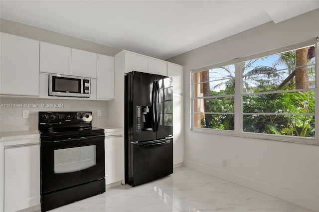 kitchen with black appliances, decorative backsplash, and white cabinets