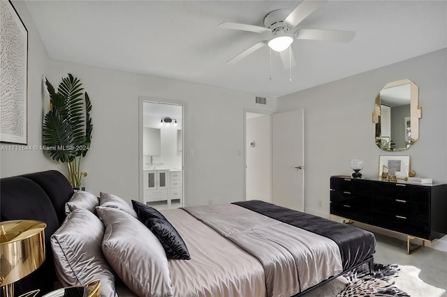 bedroom featuring ceiling fan and connected bathroom