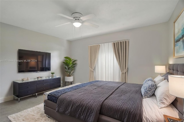 bedroom with ceiling fan and light colored carpet