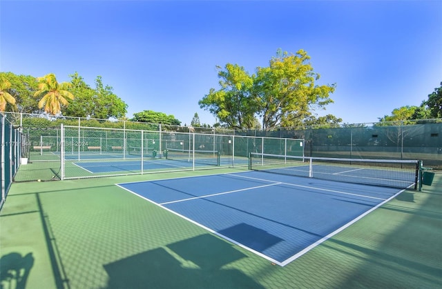 view of sport court with basketball hoop