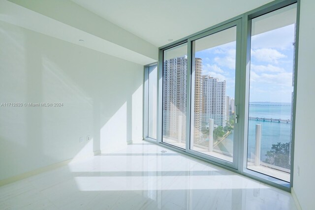 spare room featuring expansive windows