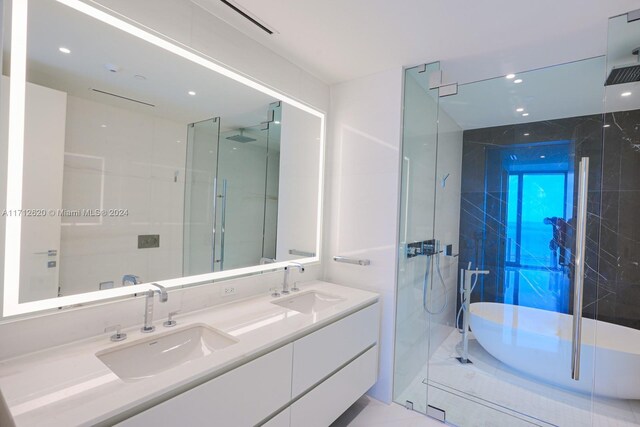 kitchen with pendant lighting, expansive windows, white cabinets, and sink