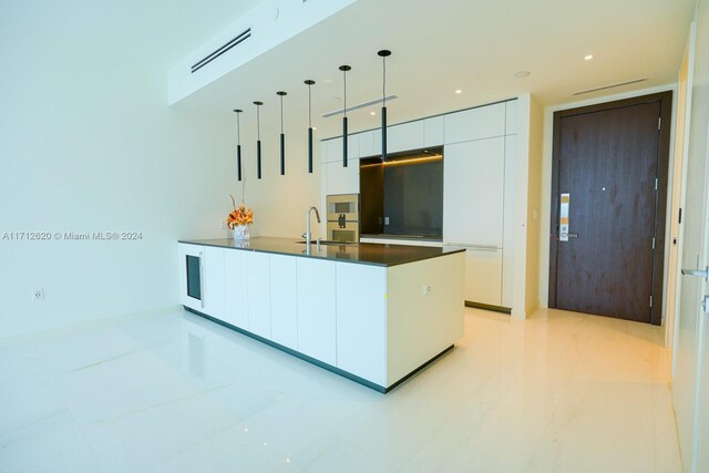 empty room featuring floor to ceiling windows and a water view