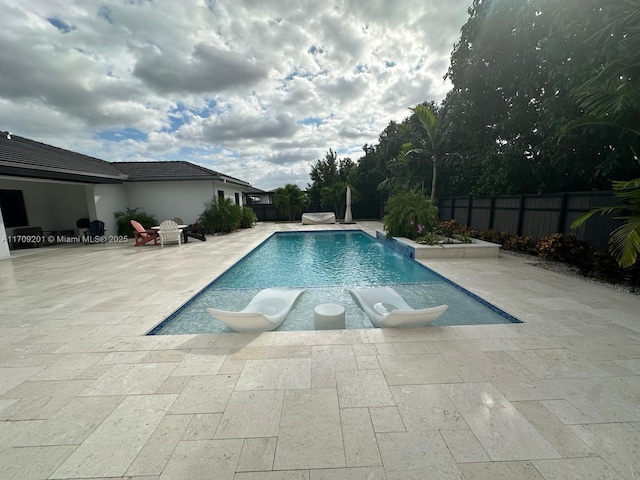 view of pool featuring a patio and pool water feature