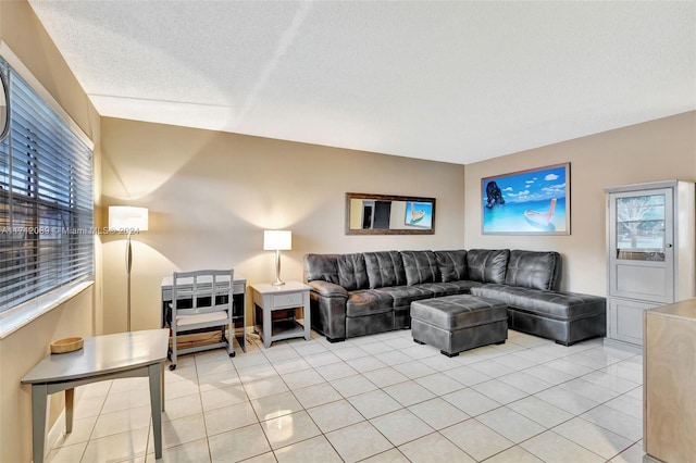 living room with light tile patterned floors and a textured ceiling