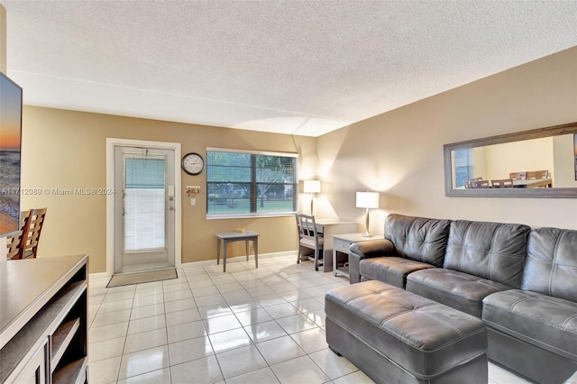 tiled living room with a textured ceiling