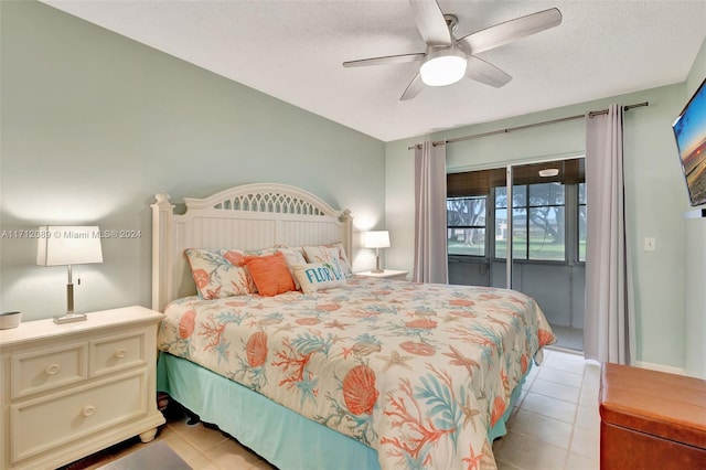 tiled bedroom with access to exterior, a textured ceiling, and ceiling fan