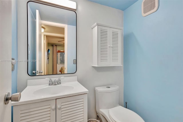 bathroom with vanity and toilet