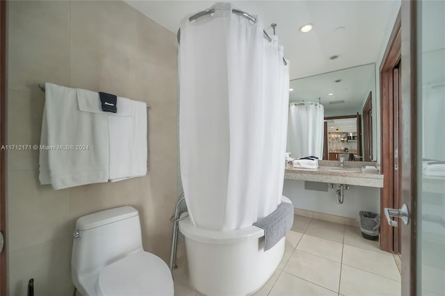 bathroom featuring tile patterned flooring and toilet