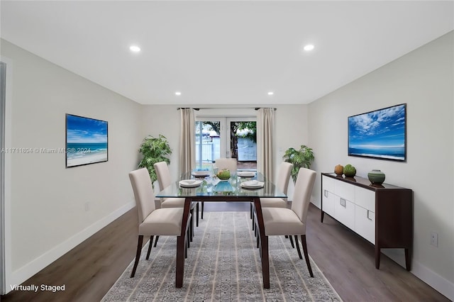 dining space with french doors and dark hardwood / wood-style floors