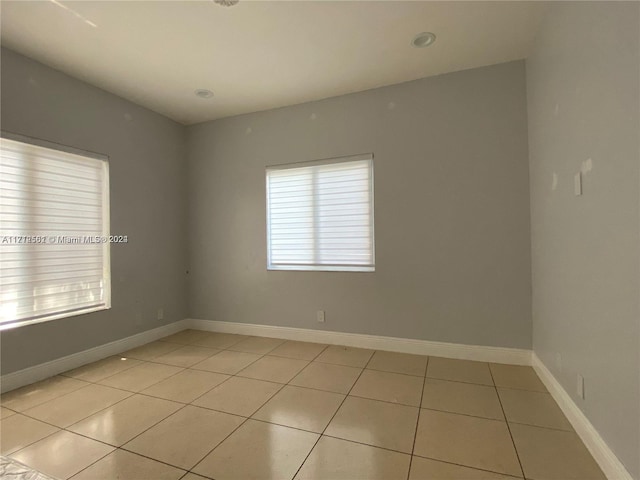 empty room featuring light tile patterned flooring