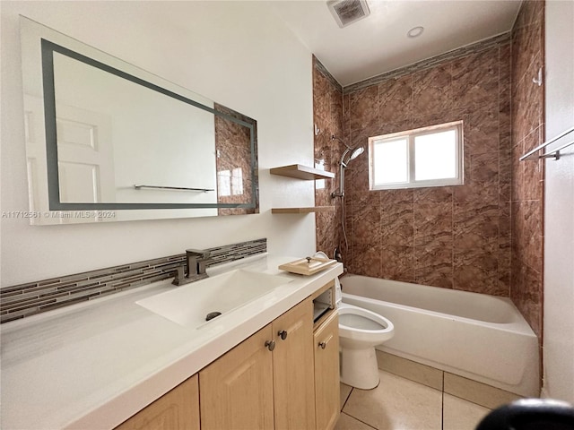 full bathroom with toilet, vanity, tile patterned floors, and tiled shower / bath