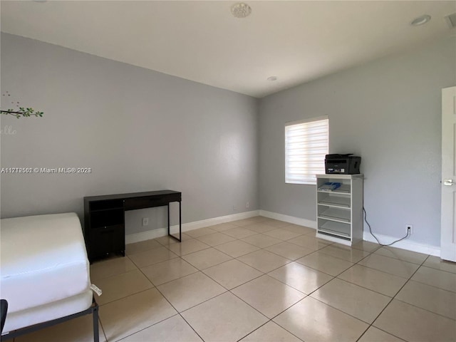 unfurnished bedroom featuring light tile patterned flooring