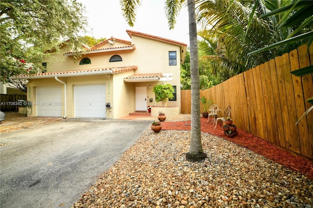 mediterranean / spanish-style home featuring a garage