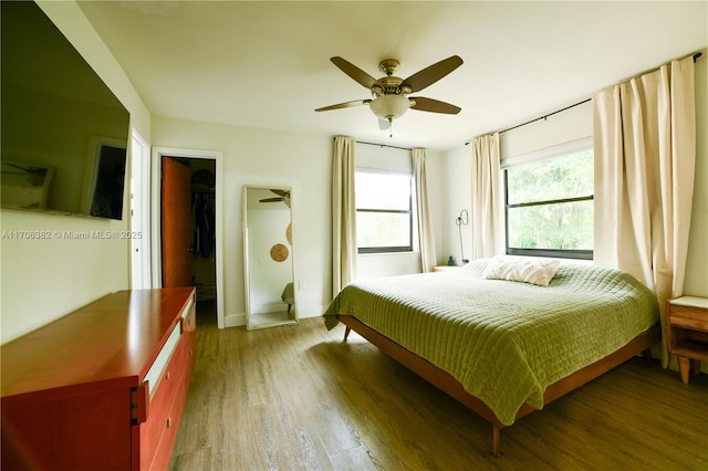 bedroom featuring ceiling fan and dark wood-type flooring