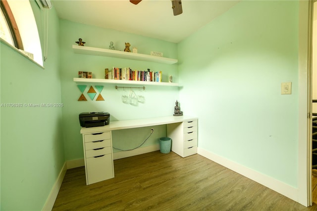 unfurnished office featuring ceiling fan and hardwood / wood-style flooring