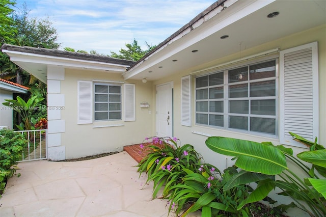 entrance to property with a patio area