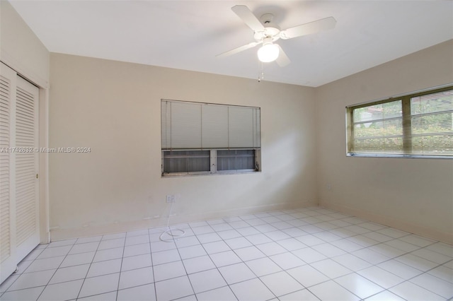 4241 Red Rd, Coral Gables, FL 33134 - empty room with ceiling fan and light tile patterned floors