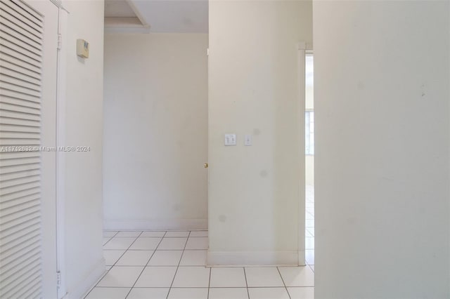 4241 Red Rd, Coral Gables, FL 33134 - hallway with light tile patterned floors and healthy amount of natural light