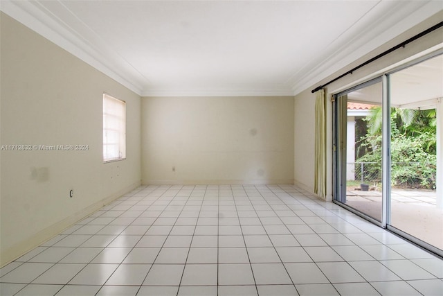 tiled spare room with plenty of natural light and ornamental molding