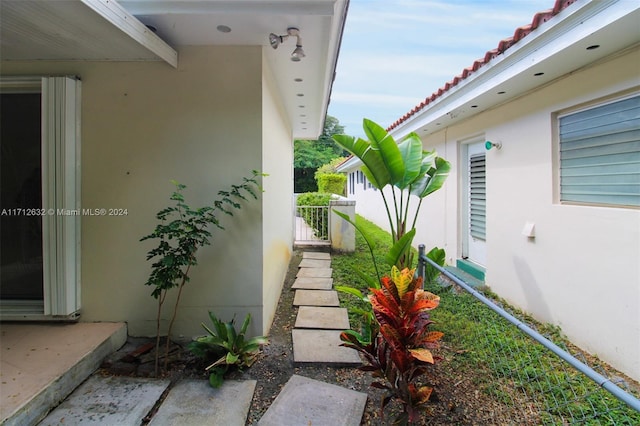 4241 Red Rd, Coral Gables, FL 33134 - view of home's exterior with a tiled roof and stucco siding