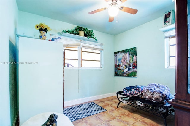 interior space featuring ceiling fan