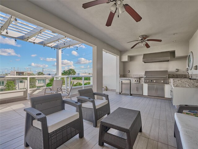 view of patio with ceiling fan, area for grilling, an outdoor hangout area, and a pergola