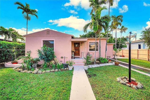 view of front of property with a front lawn