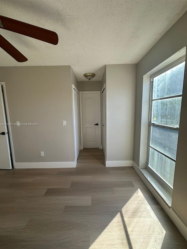 empty room featuring hardwood / wood-style floors and a textured ceiling