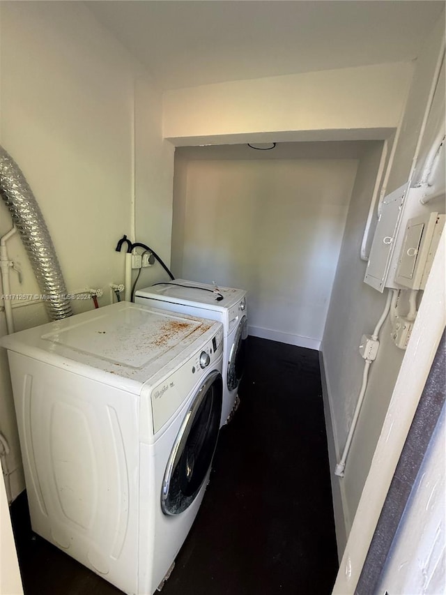 washroom featuring washer and clothes dryer