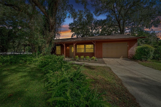 ranch-style house featuring a garage