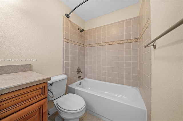 full bathroom featuring toilet, vanity, and tiled shower / bath