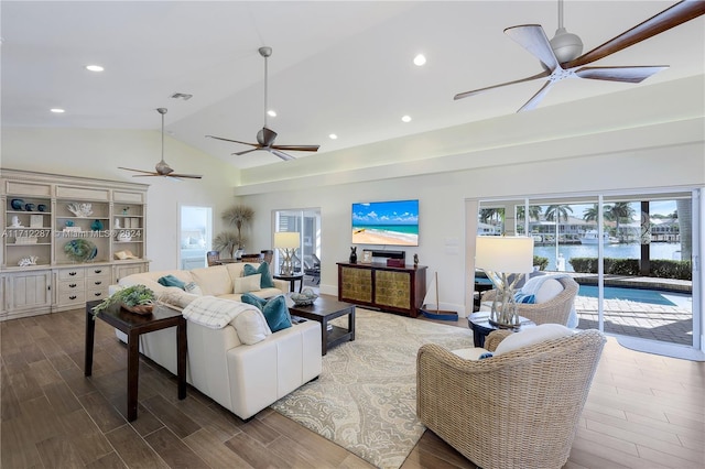 living room with high vaulted ceiling and wood-type flooring