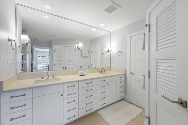 bathroom featuring tile patterned floors and vanity