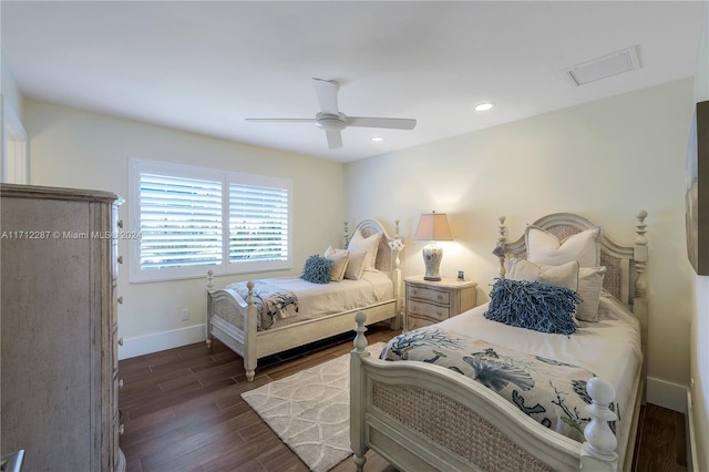 bedroom featuring ceiling fan and dark hardwood / wood-style floors